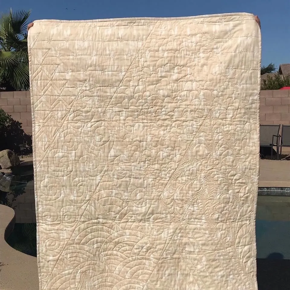 Allover quilting texture on a cream quilt